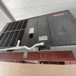 Before, the original 14-year-old package unit,with rust on the supporting frame
